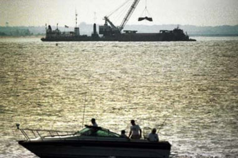 Dump, Ocean Dumping off New Jersey will end in September. This is one of the last sites where dredge spoil are being loaded into barges and ship to sea. This is Sandy Hook Bay and it looks WSW from Fort Hancock toward the turning basin at the Naval Weapons Station at Earle.