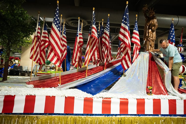 Jeremy Williams, works on a float back stage with the crews of the Fourth of July parade and festival, on floats for the big 4th of July parade, in Philadelphia, June 29, 2026.