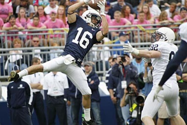 Devin Pryor intercepts a pass intended for Brian Irvin during the annual Blue-White Game. (Keith Srakocic/AP)