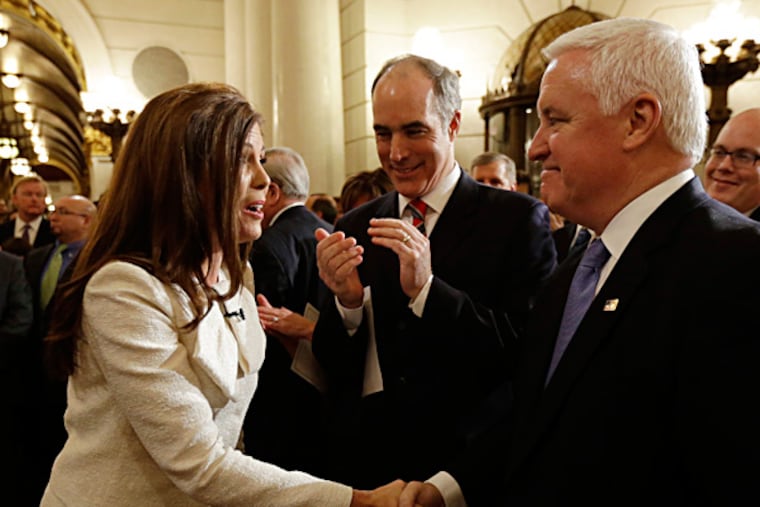 Gov. Corbett (right) and U.S. Sen. Bob Casey greeted Kathleen Kane before she took her oath of office as state attorney general this month. MATT ROURKE / Associated Press