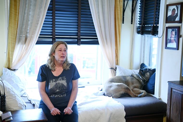 Arianne Bennett in her Washington, D.C., apartment. Her husband, Scott Bennett, in the photo at top right, died of COVID-19 in January. He was fully vaccinated and boosted.