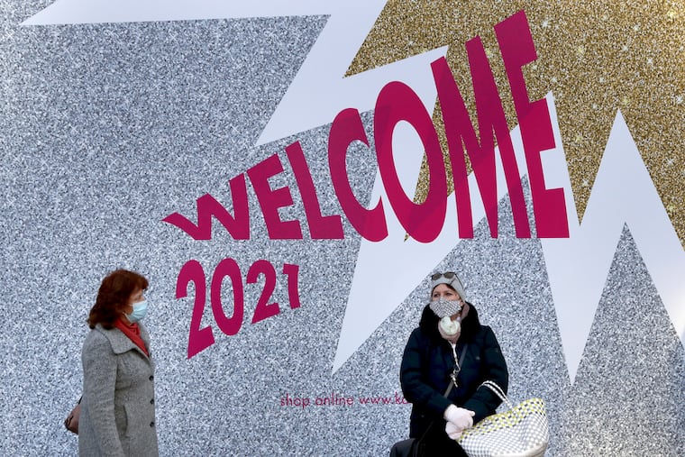 People wear face masks as they queue in front of the KaDeWe department store in Berlin, Germany. Germany is entering 2021 in a lockdown that appears certain to be extended beyond its current Jan. 10 end date, with new coronavirus cases and deaths related to COVID-19 remaining at worryingly high levels. The country has recorded well more than 1.6 million cases so far, including more than 32,000 deaths.