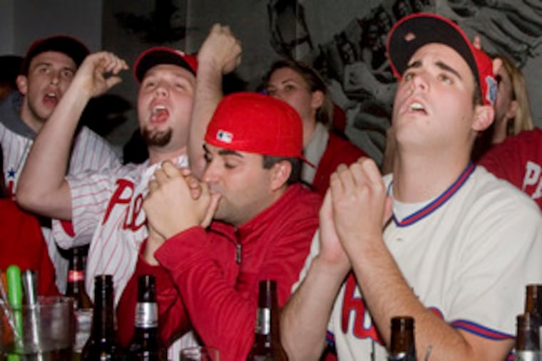 Before the tie, before the deluge, there was hope in the air at Miami Cafe on South Street near Fourth. The trio of tentative optimists were (from left) Mark Balistreri (arms raised), Rich Fagan and Will McPhaden.
