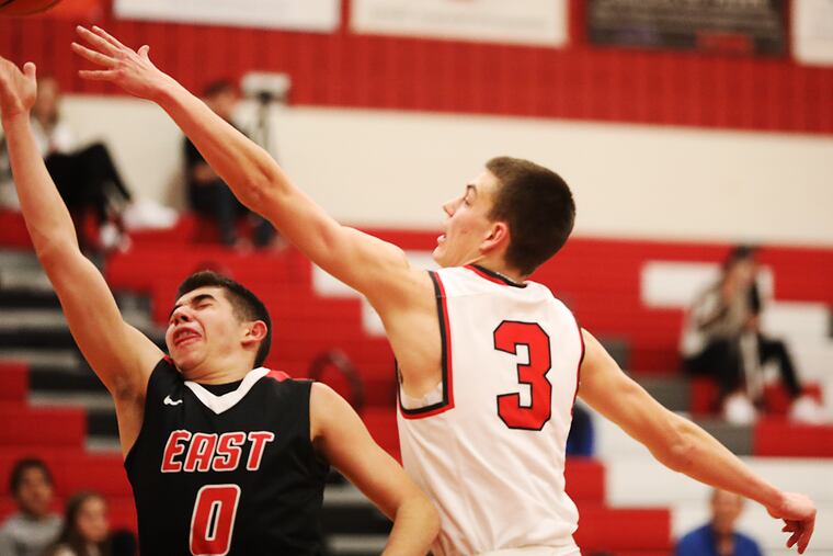 Cherry Hill East at Lenape HS boys' Basketball east Hs Game. -- Lenape HS #3 Luke Spitznas blocks Cherry Hill East HS #0 Ryan Greene's shoot under the basket at First Period
Jan,29, 2019 AKIRA SUWA / For The Inquirer.