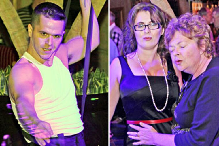 From left, Nicholas "Rocco" Definis, Julia Arikh and Kate Tedder dance at Prohibition. (Tom Briglia / For the Daily News)