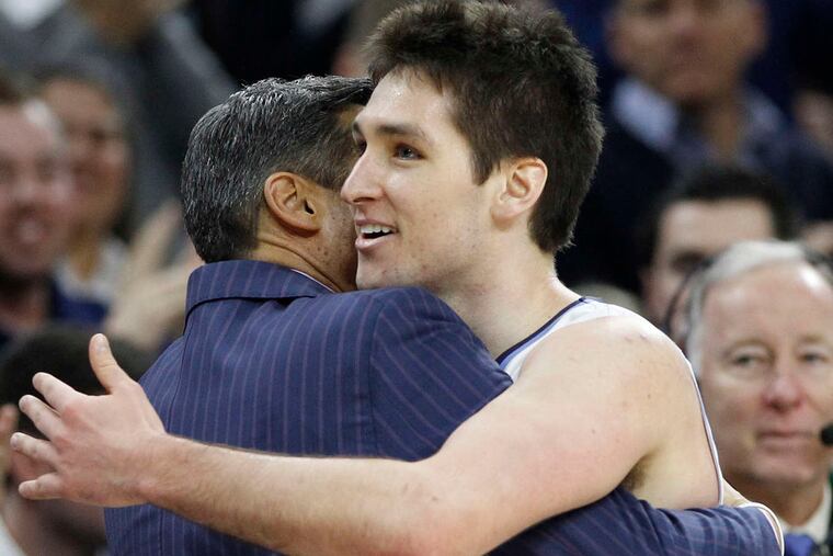 Senior Ryan Arcidiacono, hugging coach Jay Wright, has represented the Wildcats well. CHARLES FOX / Staff Photographer