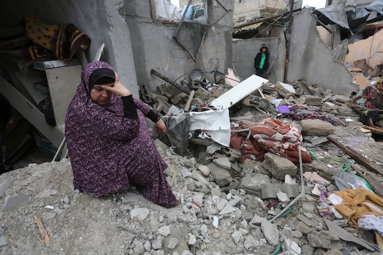 A Palestinian sits amid the destruction after Israeli strikes on Rafah, in the Gaza Strip, on Wednesday.