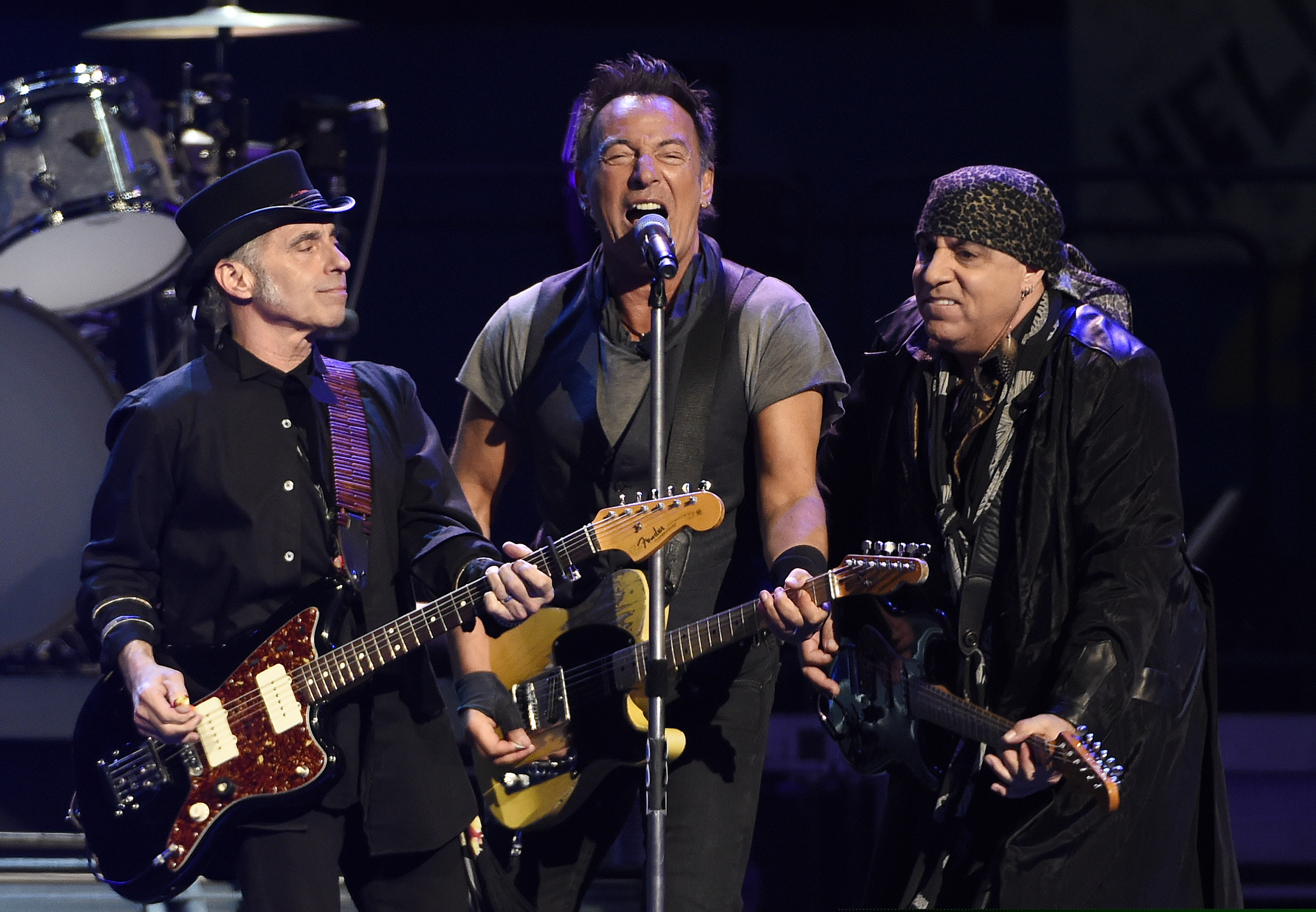 FILE - In this March 15, 2016 file photo, Bruce Springsteen, center, performs with Nils Lofgren, left, and Steven Van Zandt of the E Street Band during their concert at the Los Angeles Sports Arena in Los Angeles. Springsteen will release a new rock album he recorded live in his New Jersey home studio with the E Street Band. The Boss said Thursday, Sept. 10, 2020, the album is called “Letter to You” and he and the band recorded it in just five days. It will be released on Oct. 23. (Photo by Chris Pizzello/Invision/AP, File)
