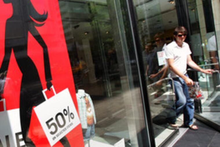 A shopper leaves a Chicago store with his purchases. The 0.6 percent increase in September retail sales announced yesterday was double the gain in August.