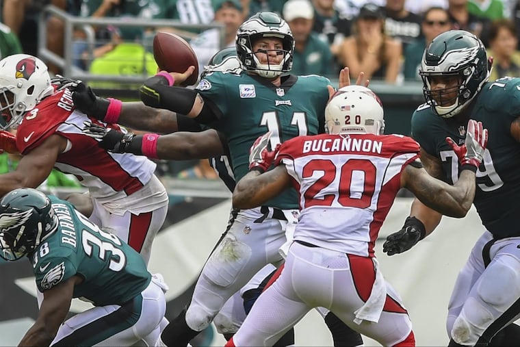 Eagles quarterback Carson Wentz rears back to fire a bomb to wide receiver Nelson Agholor for a 72-yard touchdown in the third quarter Sunday.