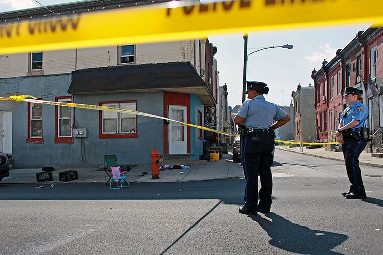 Officers guard the scene, where a child’s beach chair was abandoned in the chaos. JOSEPH KACZMAREK / FOR THE DAILY NEWS