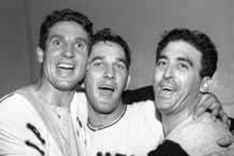 Bobby Thomson (left), Larry Jansen and Sal Maglie celebrating the Giants' 1951 pennant clincher.