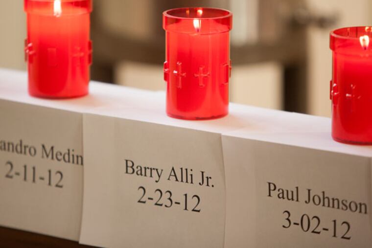 Turnout was light Friday afternoon at Camden's Cathedral of the Immaculate Conception where a four day, 60 hour vigil began for Camden's 67 homicide victims om 2-12. The event sponsored by the Guadalupe Family Services organization ends Monday. Here, candles lit to pay respect for the victims.( Ed Hille / Staff Photographer )
