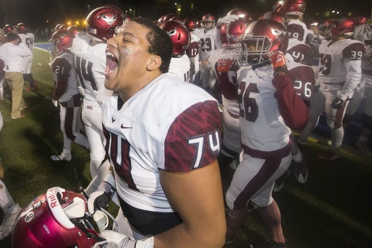 Ryan Bryce of St. Jospeh’s’s Prep and his teammates celebrate their 53-49 victory over Coatesville at Downingtown West in a PIAA Class 6A Semifinal on Friday.