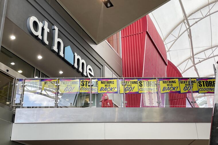 Signs announcing a store closing outside an At Home location in Rego Park in Queens, N.Y., in June.