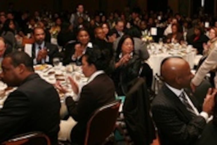 Patricia A. Coulter , president and CEO, is congratulated at the Urban League's Whitney M. Young Jr.'s Community Empowerment Awards Luncheon.
