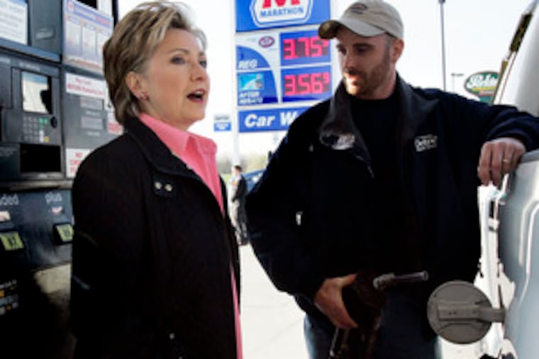 Sen. Hillary Rodham Clinton , in Indiana, talks about fuel costs as sheet-metal worker Jason Wilfing gases up.