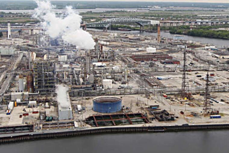 The Sunoco refinery along the Schuylkill. The 1,400 acres spark in dreamers grand visions of new land uses, but a city official says that given the site's history, industrial or commercial activities make more economic sense. MICHAEL BRYANT / Staff Photographer