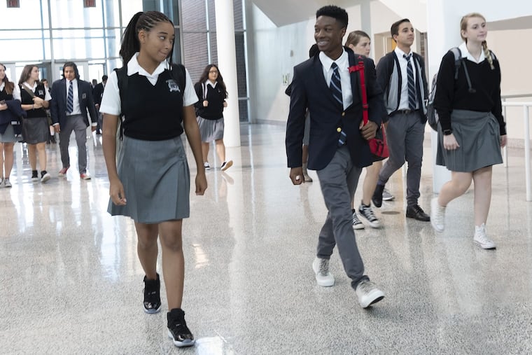 Amandla Stenberg and Lamar Johnson in the film, "The Hate U Give."