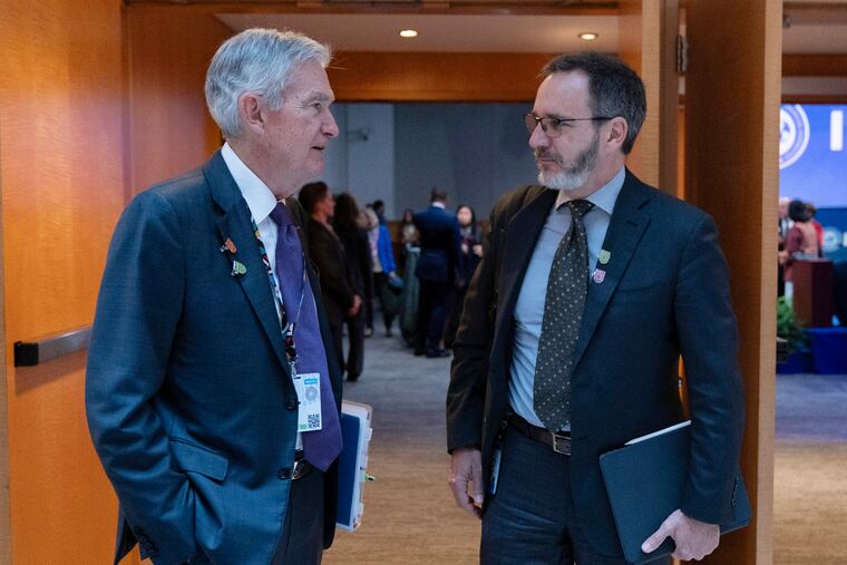 Federal Reserve Chair Jerome Powell (left) speaks with Pierre-Olivier Gourinchas, IMF Economic Counsellor and Research Department director, as they arrive for a session during the World Bank/IMF Spring Meetings at the International Monetary Fund (IMF) headquarters in Washington, Friday, April 25, 2025.