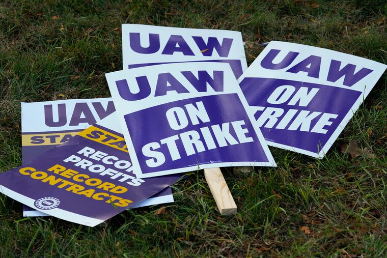 United Auto Workers signs for a strike are shown at the Stellantis Sterling Heights Assembly Plant, in Sterling Heights, Mich.