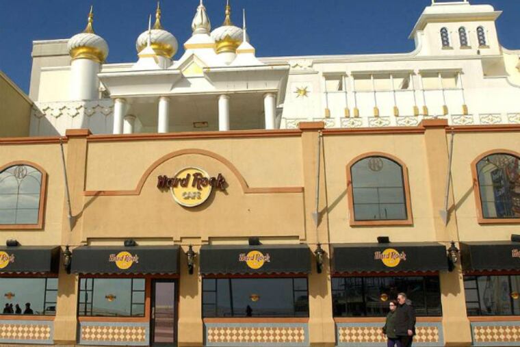 The Hard Rock Cafe at Trump Taj Mahal Hotel & Casino has filed notice that it might close in April. Its parent company says the cafe plans to operate through its current lease, which expires at the end of 2016. The Taj is trying to emerge from bankruptcy under its new owner, investor Carl Icahn. (File photo)