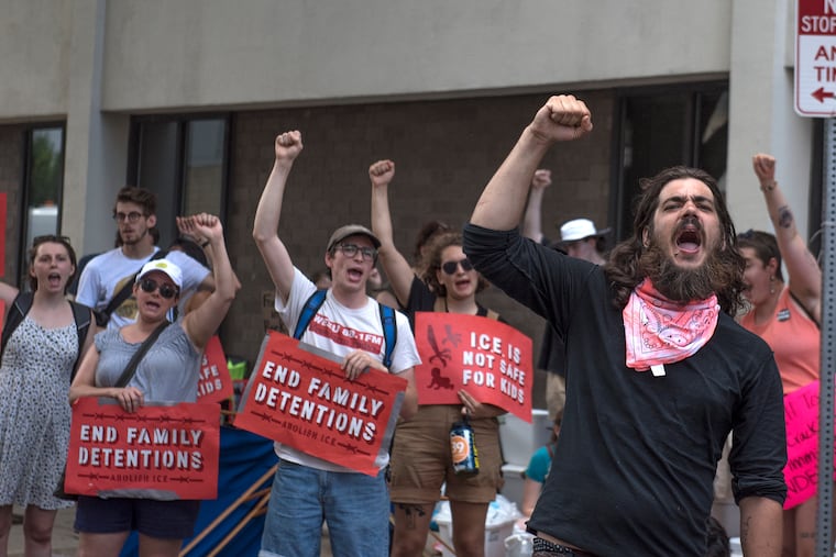 People protest outside the Center City office of ICE after their encampment was raided and before their press conference began. They call for the closure of the family detention center in Berks County, the abolition of ICE, and an end to what they said was "collaboration" by the city with ICE.