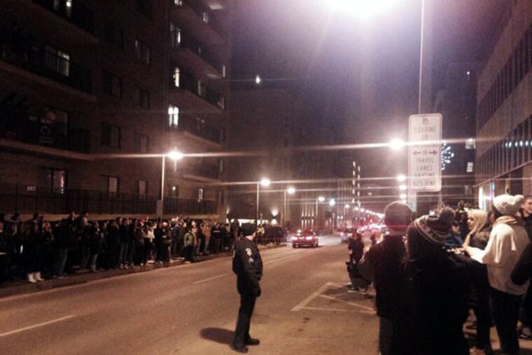 Students line Beaver Avenue in State College on Friday, Jan. 16. Police patrol as the crowd yells "Shut down Beaver" and "We want the street."