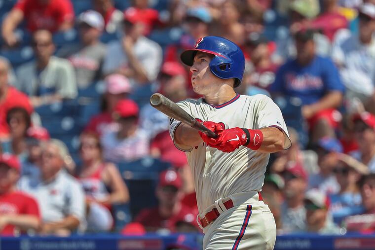 J.T. Realmuto watches his grand slam fly out of the field.
