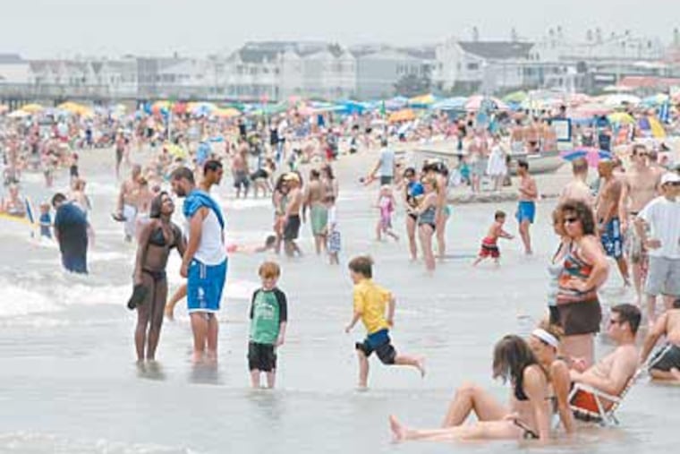 Visitors in Ocean City, N.J., say they can’t remember the water being so warm so early in the season. At midday Wednesday it was 72 degrees. (April Saul / Staff Photographer)