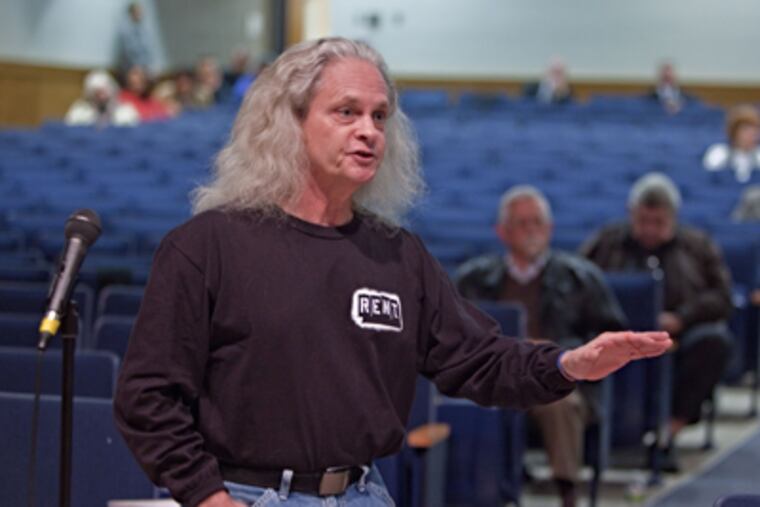 Paul Bracy, of Mt. Holly, poses a question during public hearing at Burlington County Institute of Technology on Tuesday. (David M Warren / Staff Photographer)