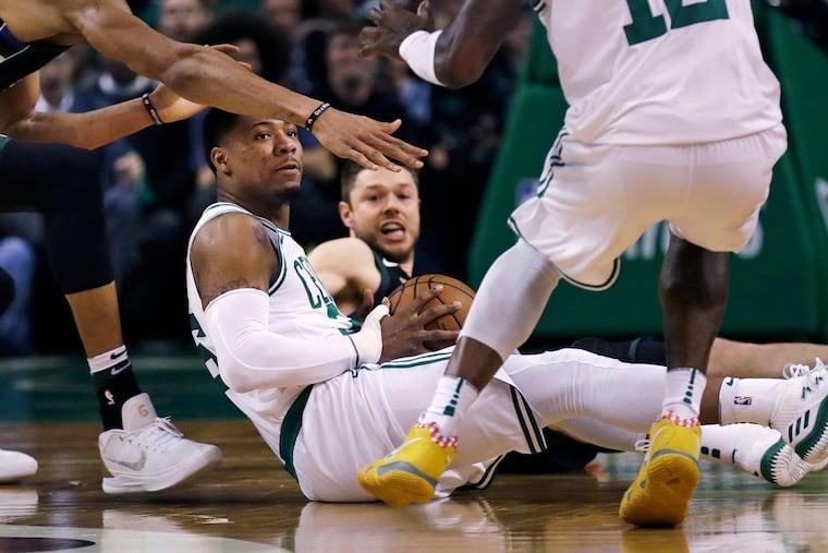 Boston Celtics guard Marcus Smart looks to pass as he recovers a loose ball during the first quarter during Game 5 of the Celtics-Bucks series.