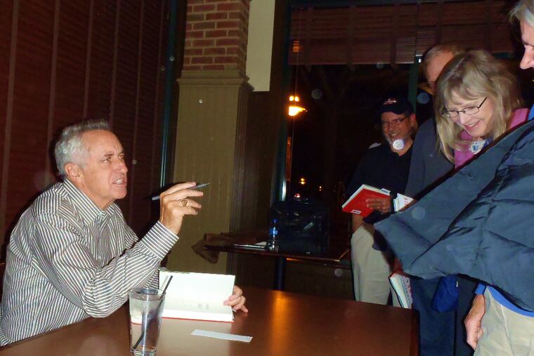 Rick Reilly makes a point at a book signing Thursday in Exton.
