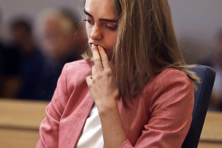 Michelle Carter listens as prosecutor Maryclare Flynn makes her opening statement, displaying many texts between Carter and Conrad Roy III.