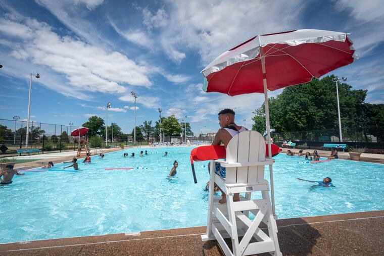 Lifeguard Wilfredo Lopez is focused and vigilant in his work at Lawncrest Recreation Center in Philadelphia.