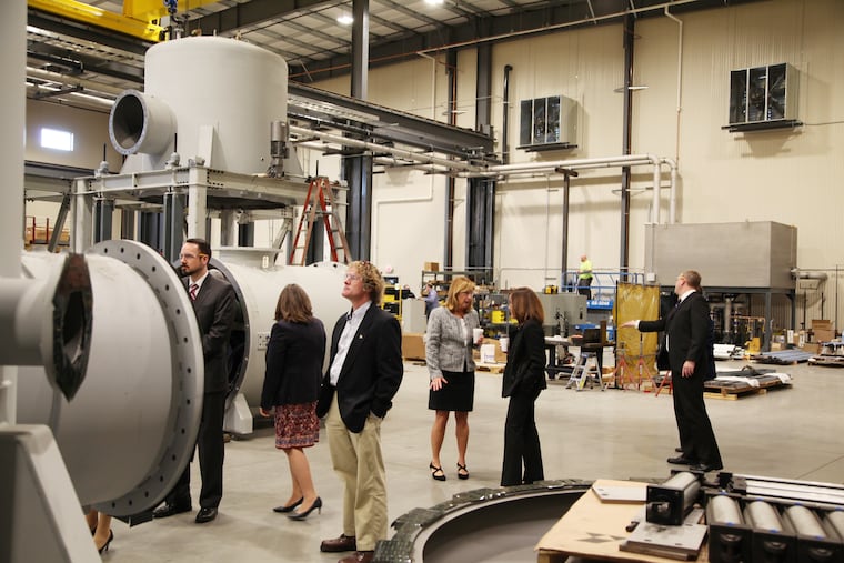 Visitors touring the Solar Manufacturing plant in Sellersville, Pa. on Thursday.