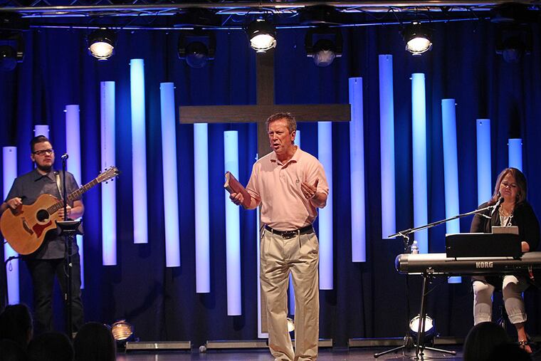 Keystone Fellowship Pastor John Cope speaks to his Montgomeryville congregation. "Instead of being one megasite of 2,000, we'd rather be four churches with 500 - and be active in those communities," he says. MICHAEL BRYANT / Staff Photographer