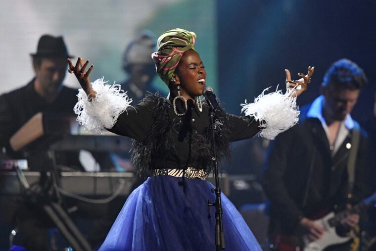 Recording artist Lauryn Hill pays tribute to Nina Simone during the Rock and Roll Hall of Fame induction ceremony, Saturday, April 14, 2018, in Cleveland. (AP Photo/David Richard)