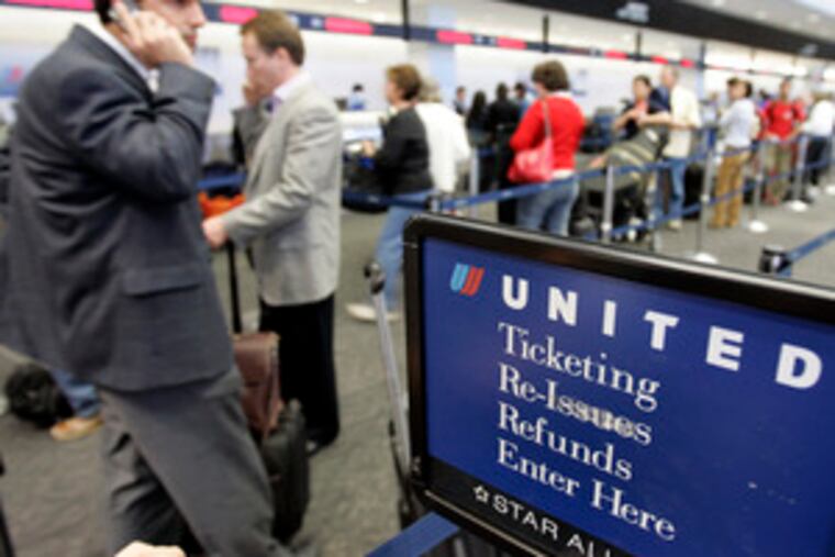 Passengers check in for United Airlines flights in San Francisco. The airline is the nation's second-largest.