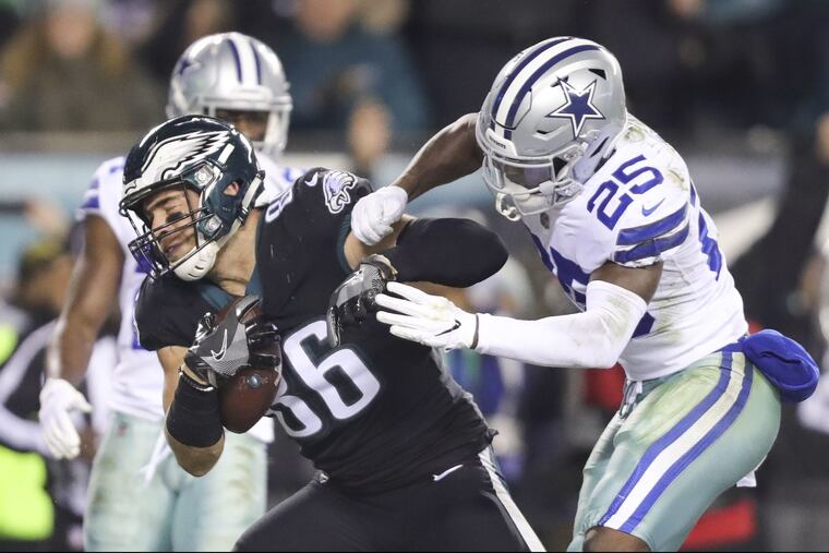 Eagles tight end Zach Ertz scores a third quarter touchdown past Dallas Cowboys free safety Xavier Woods.