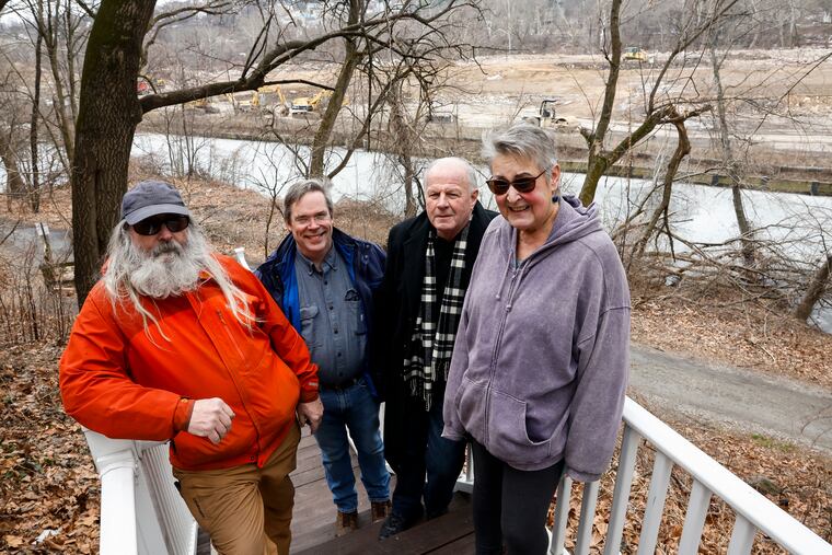 Kevin Smith, John Carpenter, John Hunter, and Kay Sykora posed for a photo overlooking construction on Venice Island in Philadelphia.