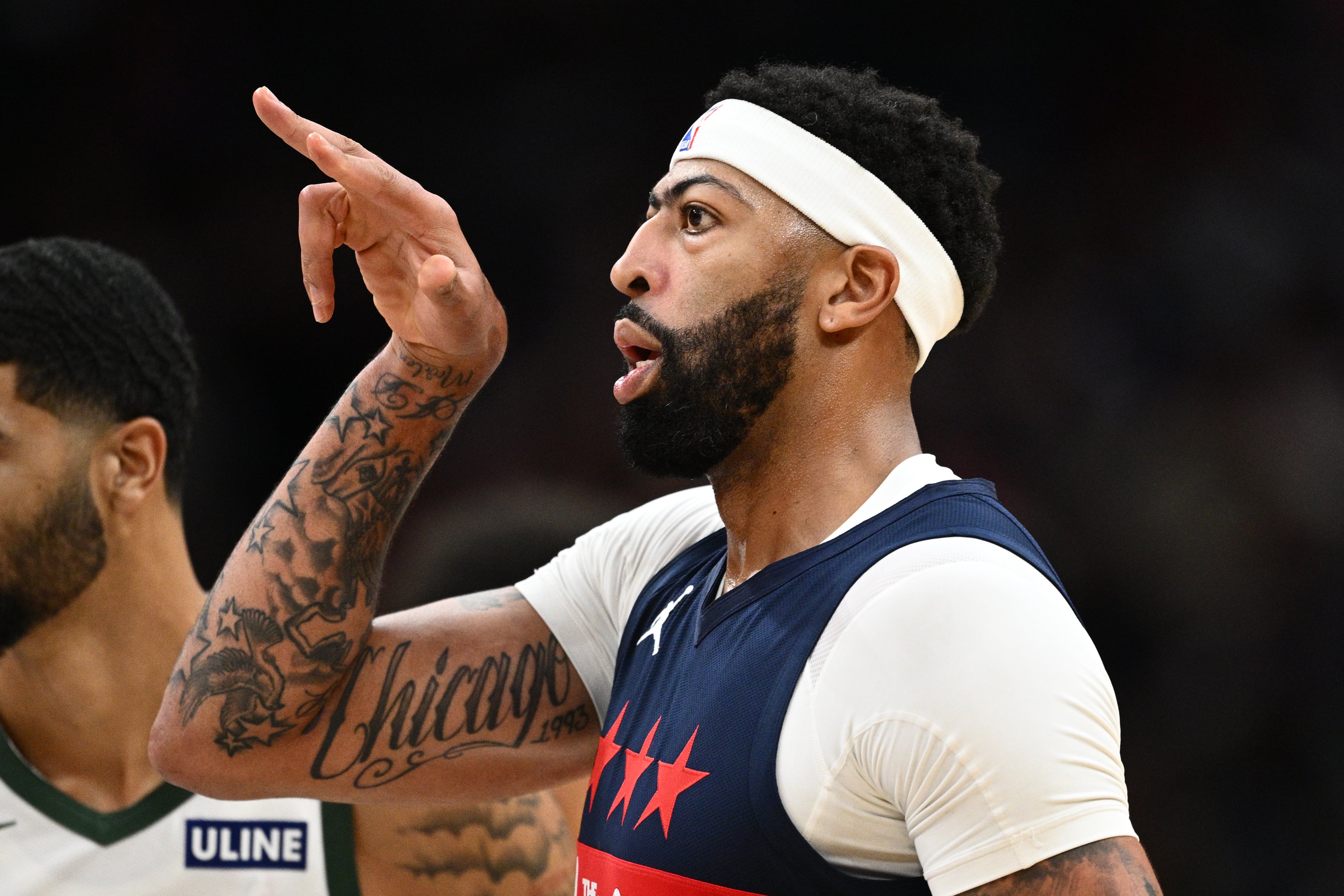Davis scores 34 points in his Washington debut, leading the Wizards over Milwaukee 128-116