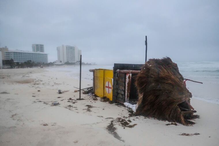 A lifeguard tower lies on its side after it was toppled over by Hurricane Delta in Cancun, Mexico, on Wednesday morning.