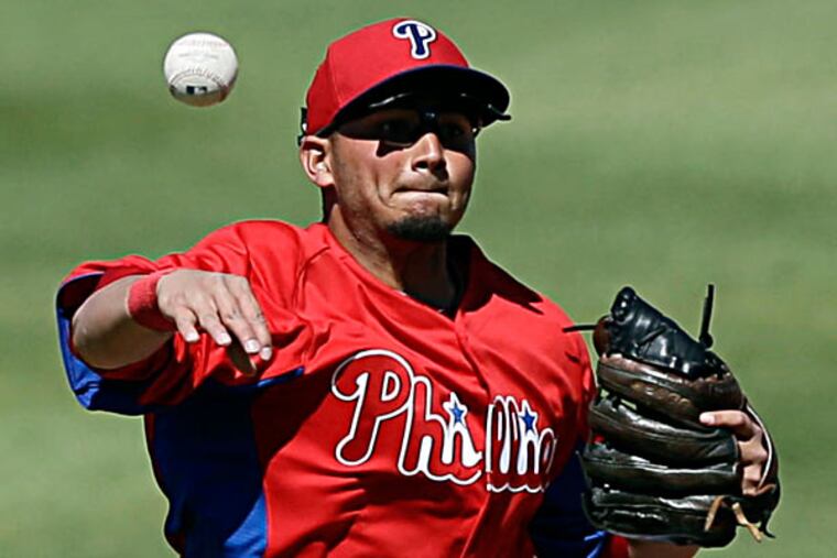 Freddy Galvis throws to first base on a ground-out by Minnesota Twins' Brian Dinkelman in the third inning of a spring training exhibition baseball game on Thursday, March 7, 2013, in Clearwater, Fla. Minnesota won 10-6. (Matt Slocum/AP)