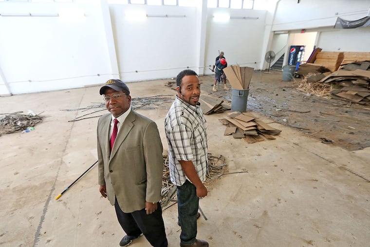 Sherman McLeod (left) and business partner Don Jackson bought the Berean Institute for $2.2 million and are renovating it to add welding classes in the former gym. (DAVID SWANSON/Staff Photographer)