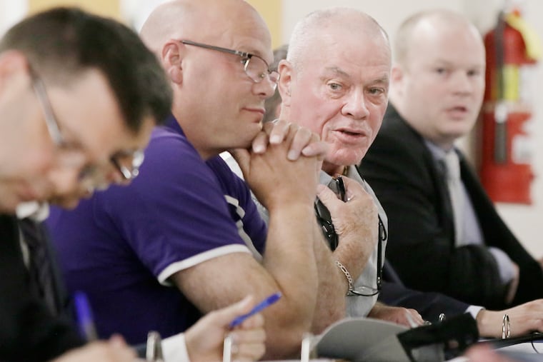 Black Horse Pike Regional Board of Education School Board President Bill Murray (2nd from right) speaks during a board meeting at Triton High School in Runnemede, NJ on May 3, 2019. Kevin Bucceroni, vice-president is to his left. South Jersey Progressive Democrats questioned whether the two men had recruited a "phantom freeholder candidate" to clutter the ballot and confuse voters in the Camden County Democratic primary on June 4.