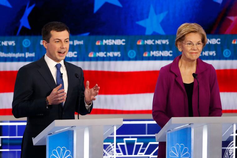 Democratic presidential candidate South Bend, Ind., Mayor Pete Buttigieg speaks as Democratic presidential candidate Sen. Elizabeth Warren, D-Mass., listens during a Democratic presidential primary debate, Wednesday, Nov. 20, 2019, in Atlanta.