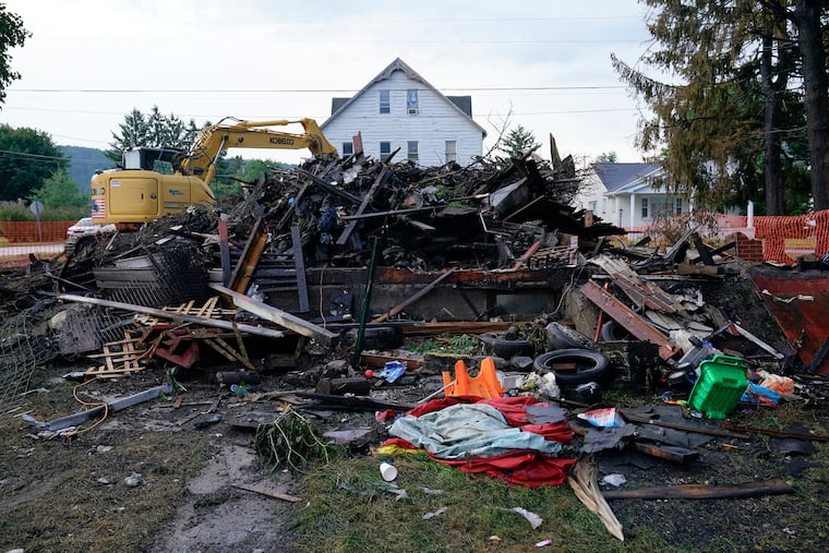 A house that was destroyed by a fatal fire is viewed in Nescopeck, Pa., Friday, Aug. 5, 2022.