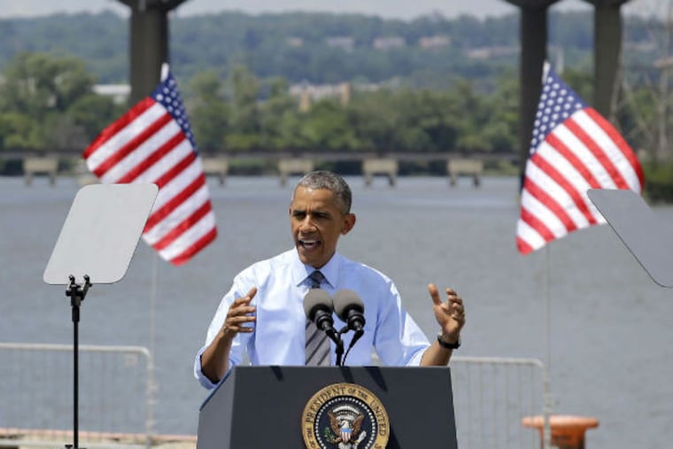 Obama speaking in front of the closed I-495 bridge in Wilmington Thursday. (Patrick Semansy / AP)