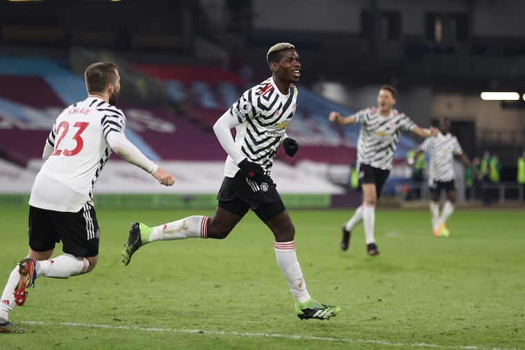 Paul Pogba, center, scored for Manchester United on Wednesday to send the Red Devils to the top of the English Premier League.